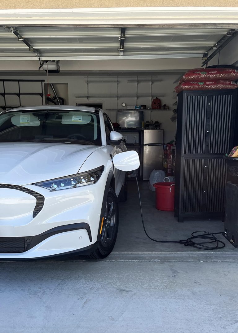 Electrician installing an EV charging station