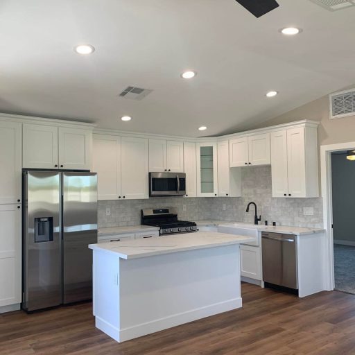 Kitchen illuminated by newly installed recessed lighting